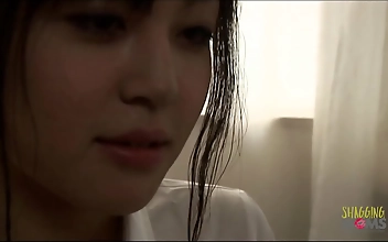 Unleash Your Desires with this Alluring Asian Babe's Luscious Lips and Big Boobs